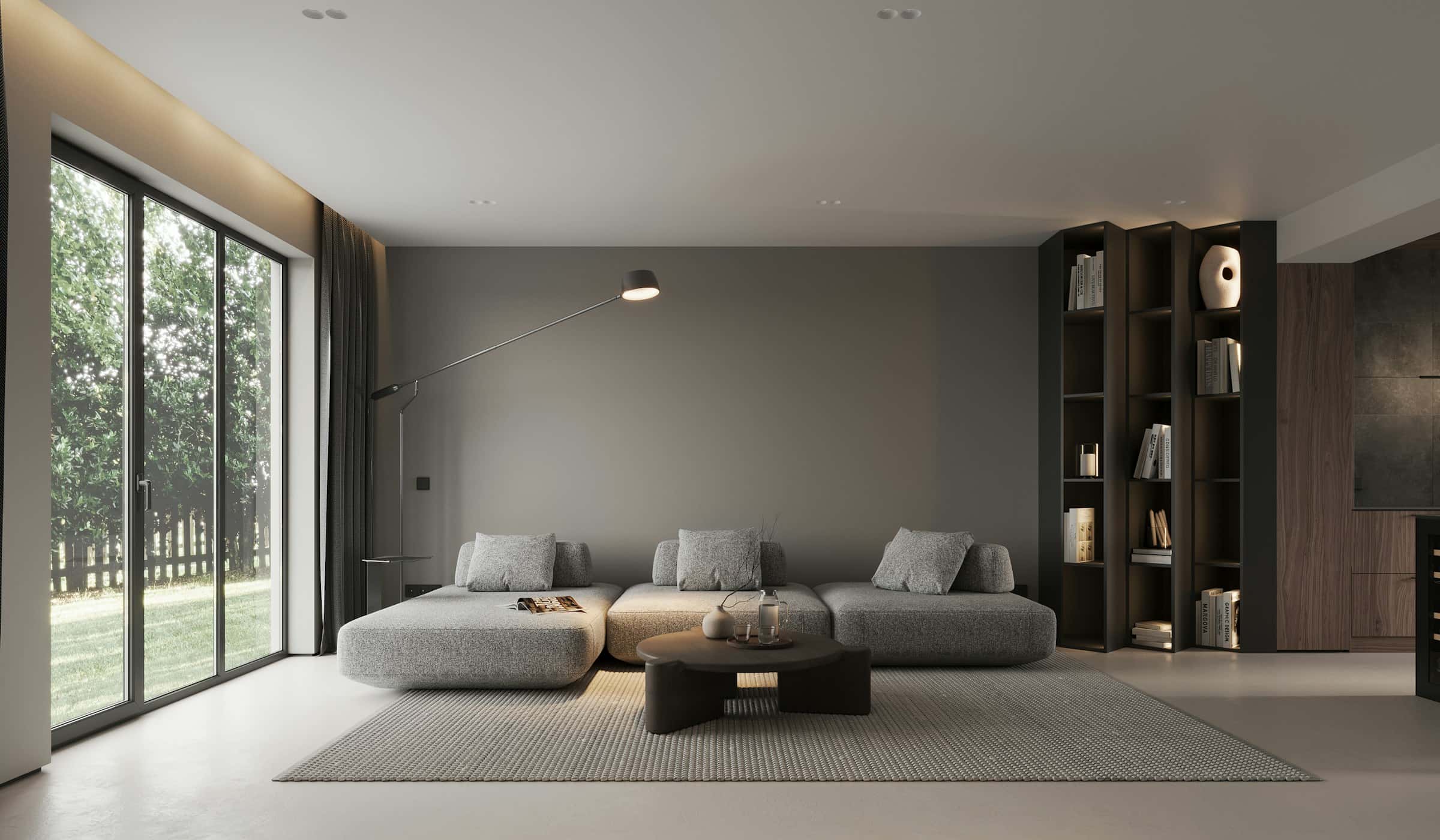 Living minimalist cu canapea modulară gri, bibliotecă din nuc și vitrină spre grădină